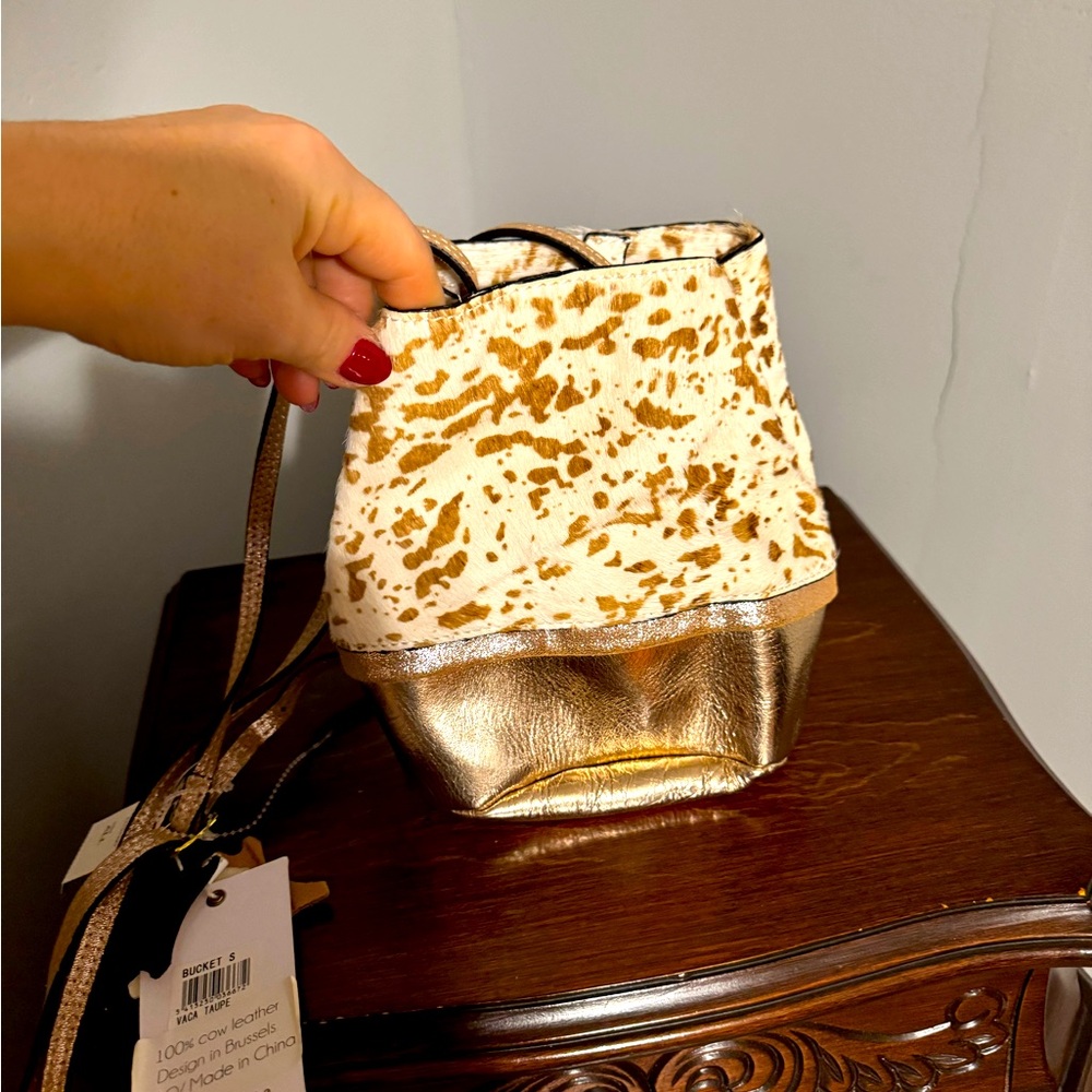 NWT Cow Print and metallic leather bucket bag